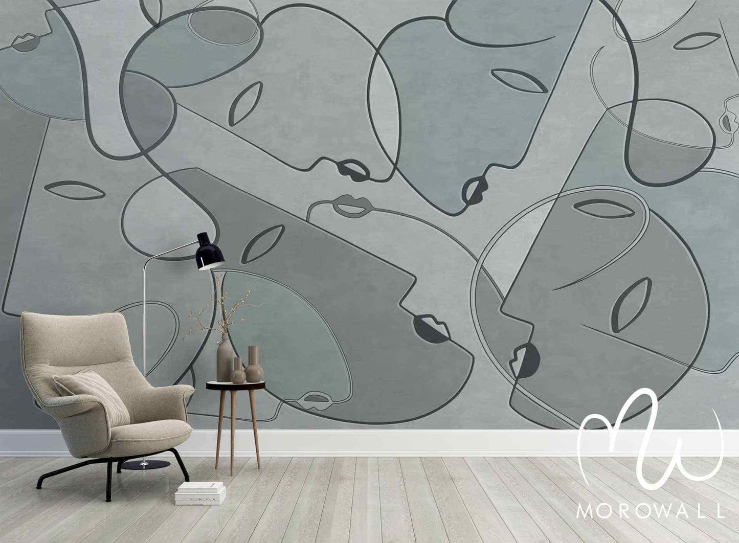 Papier peint design abstrait gris avec visages dessinés, salon moderne et fauteuil confortable